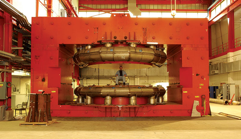 In this 2006 photo, Rutgers University graduate student Tim Koeth (now an assistant professor at the University of Maryland) sits between the poles of the Chicago Cyclotron Magnet at Fermi National Accelerator Laboratory. This type of magnet is typical of those used in high-energy physics experiments at the time of our SLAC experiment. Photo courtesy of Timothy Koeth.