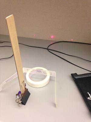 I used this apparatus to measure the wavelength of the laser and got 654nm, which falls neatly in the center of the indicated range of 630-670nm. And it's cheap too!