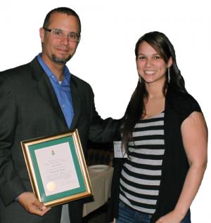 Bill DeGraffenreid inducts Gracie Conte into Sigma Pi Sigma. Photo by Heidi Yamazaki.