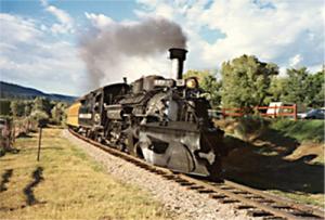 Fig. 2.  Engine No. 478 steams out of Durango, Colorado, headed for Silverton. To make this photo, light reflected from the back of the train and light emitted by the headlight had to enter my camera lens simultaneously. Light coming from the back had to catch up with the front of the train. Then light from the back and from the headlight could depart together toward the camera. Because of the train’s motion, its visual length is, in principle, longer than its measured length. Author photo.