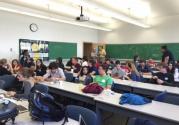 Students eating breakfast before the start of the meeting