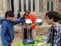 Rhodes College SPS members with the Van de Graaf generator at the annual "Rites to Play" carnival.